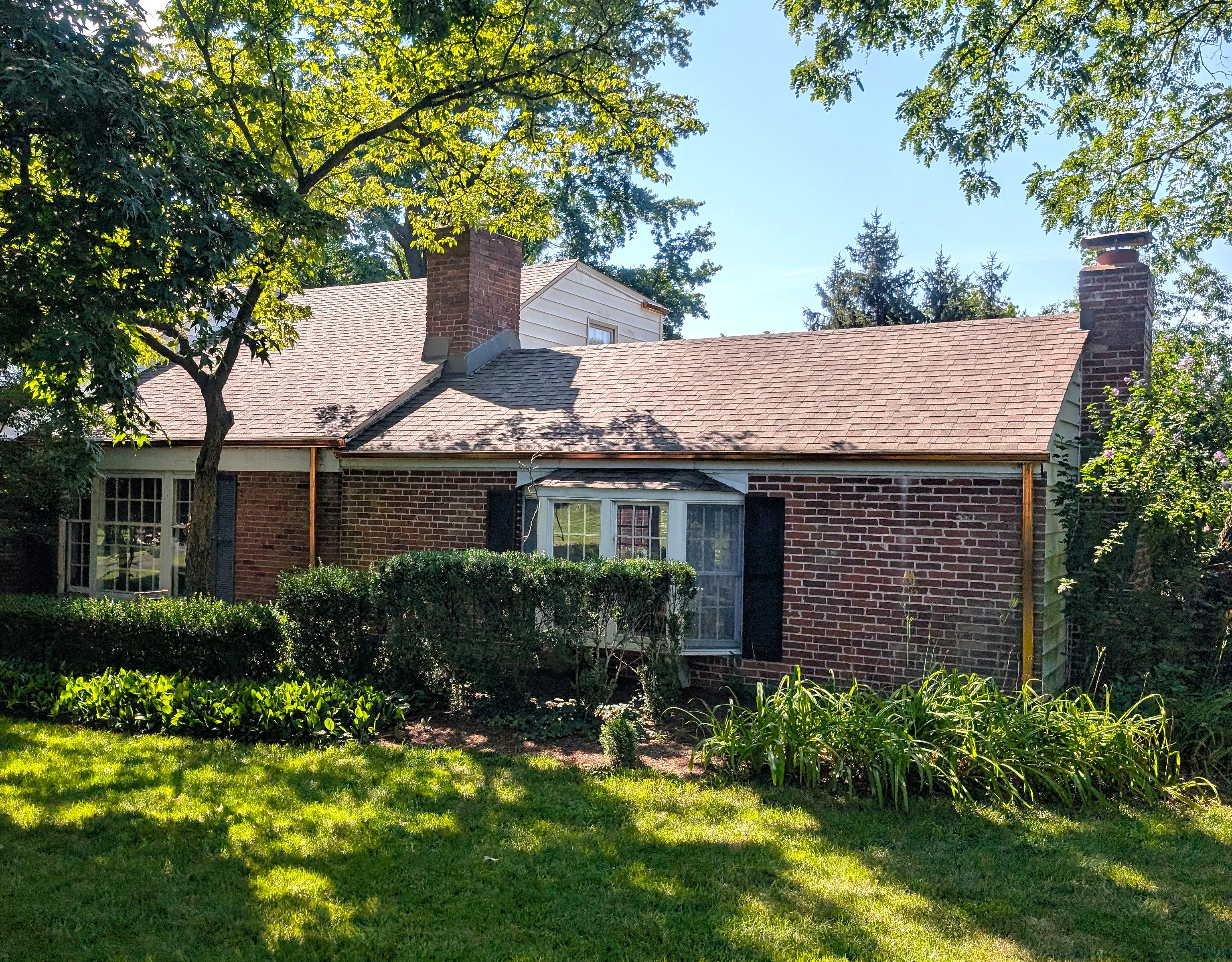 Gutter repair and maintenance service on a residential property in Plano TX