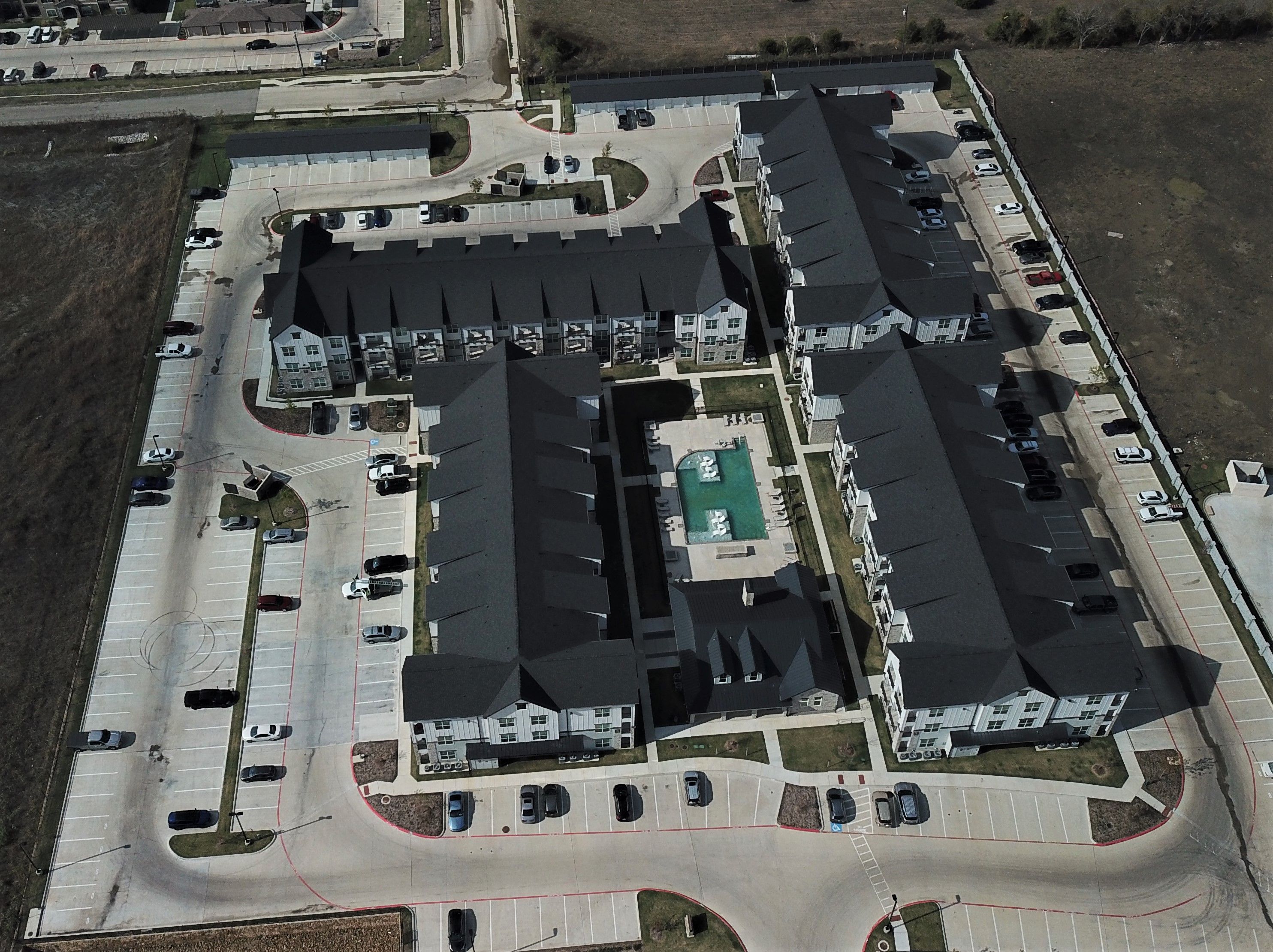 Multi-family apartment complex roof replacement by Greenleaf Roofing in DFW