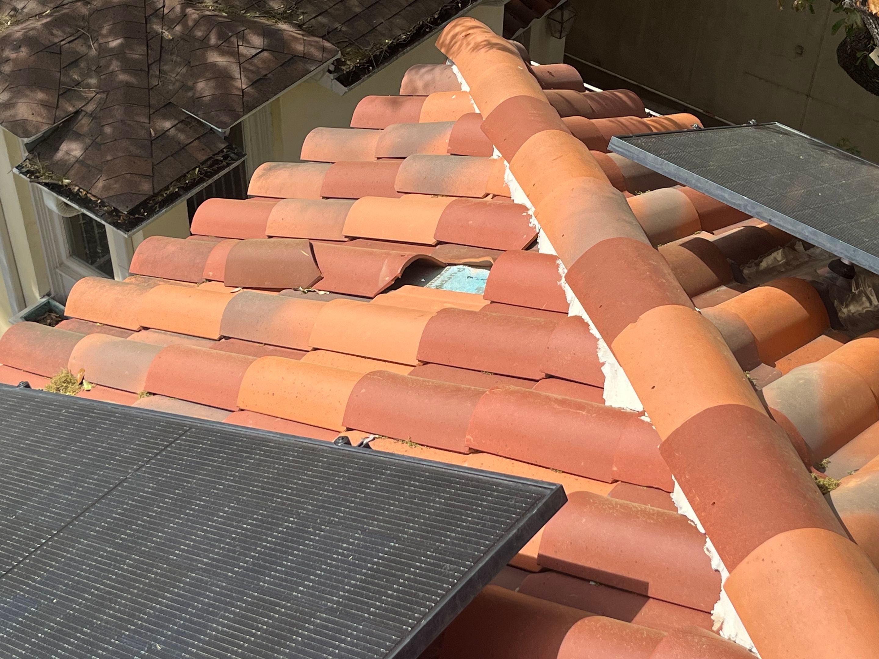 Broken tile roof requiring storm damage restoration in North Texas